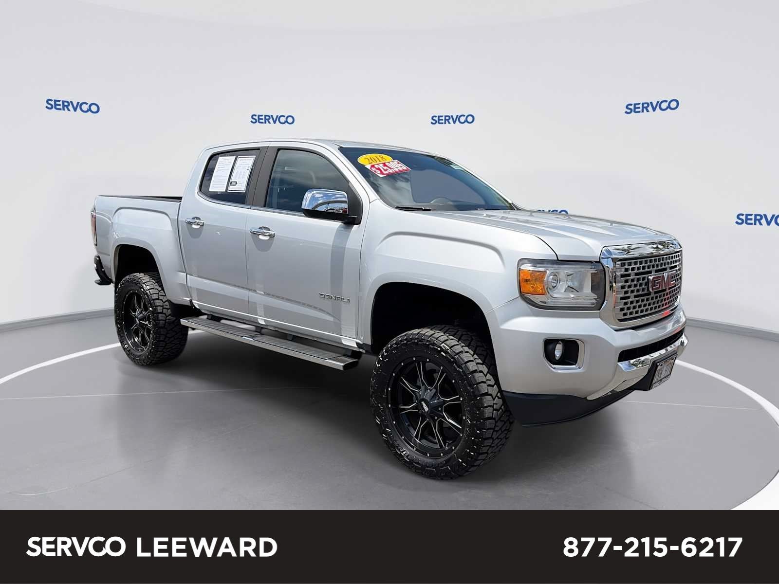 2018 GMC Canyon 4WD Denali in Quicksilver Metallic — front three-quarter view