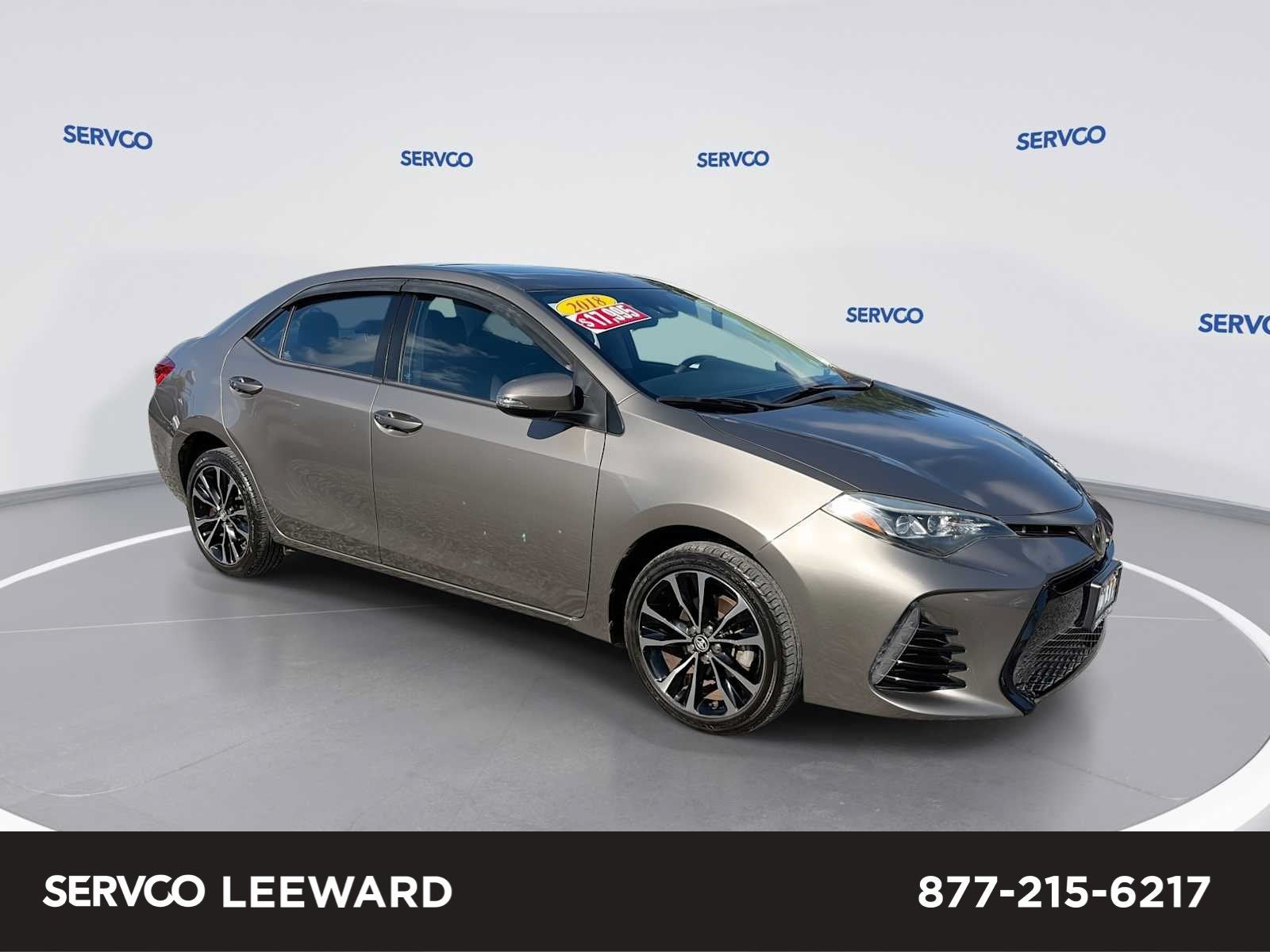 2018 Toyota Corolla L in 1G2 Falcon Gray Met. — front three-quarter view